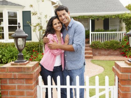 couple in front of home